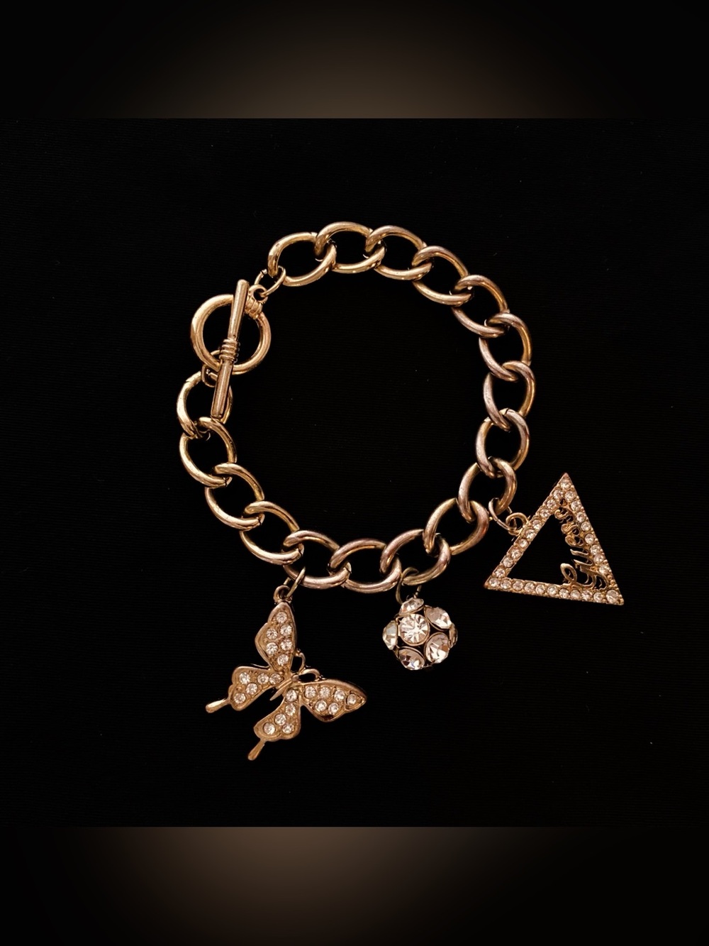 GUESS Gold-Tone Rhinestone Charm Bracelet | Pavé Crystal Clusters